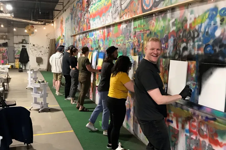 a group of people standing in front of a store