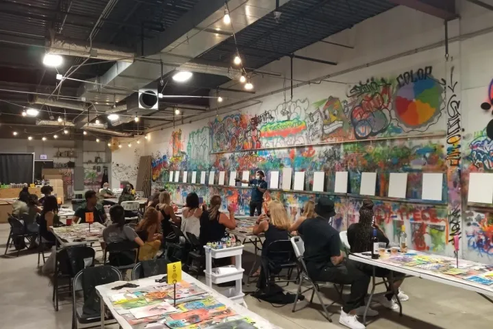 a group of people standing in front of a store